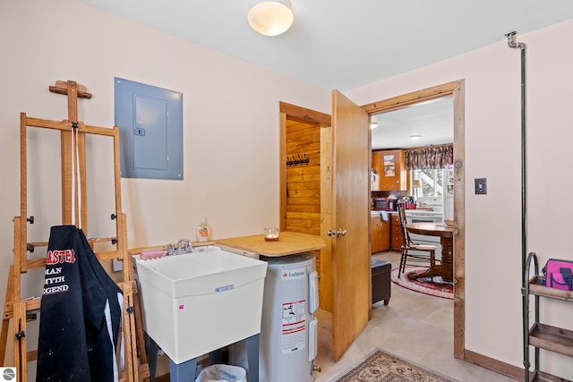 utility room featuring electric panel and sink