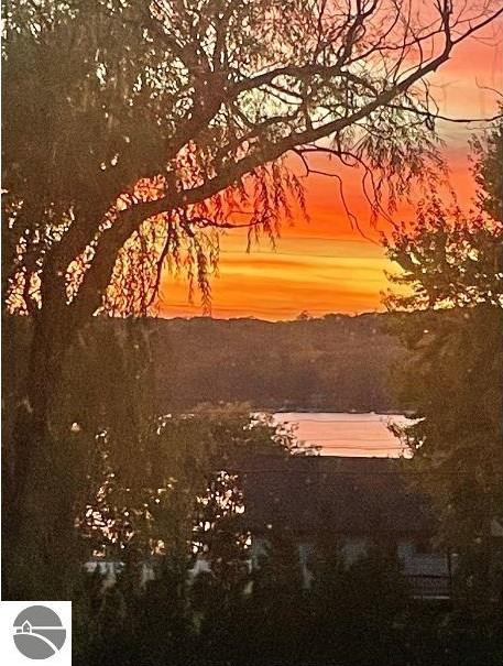 nature at dusk featuring a water view