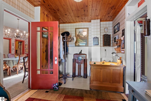 interior space with an inviting chandelier, decorative light fixtures, and wooden ceiling