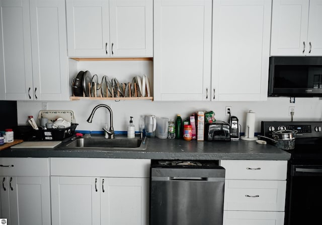 kitchen with white cabinets and black / electric stove