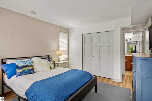 bedroom featuring light hardwood / wood-style floors and a closet