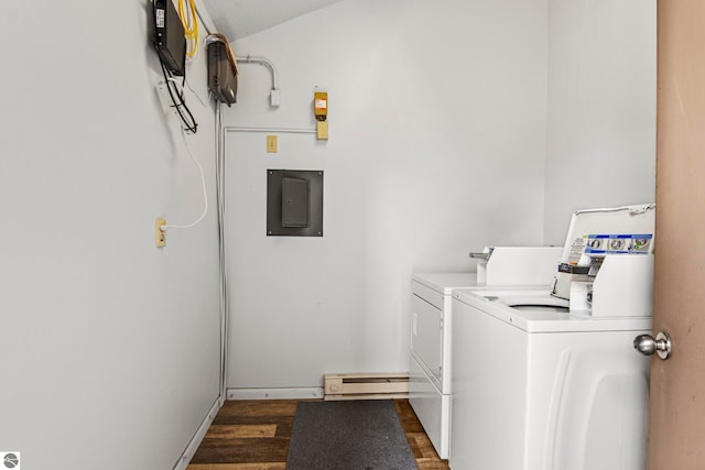 laundry room featuring a baseboard radiator, dark hardwood / wood-style floors, electric panel, and washing machine and clothes dryer