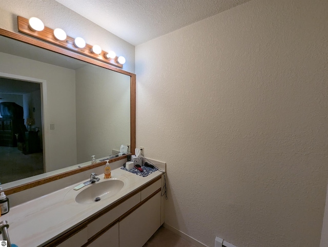 bathroom featuring vanity and a textured ceiling