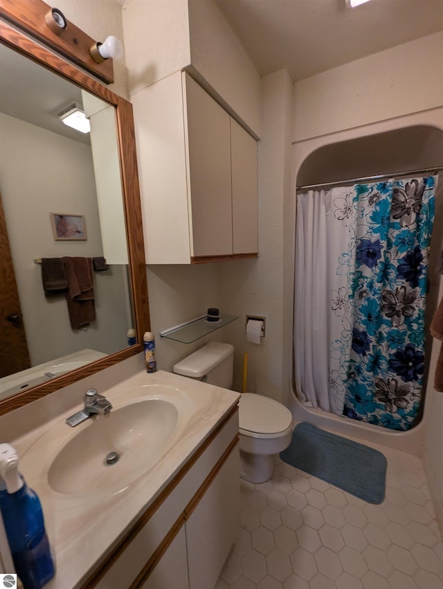 bathroom with vanity, toilet, and a shower with shower curtain