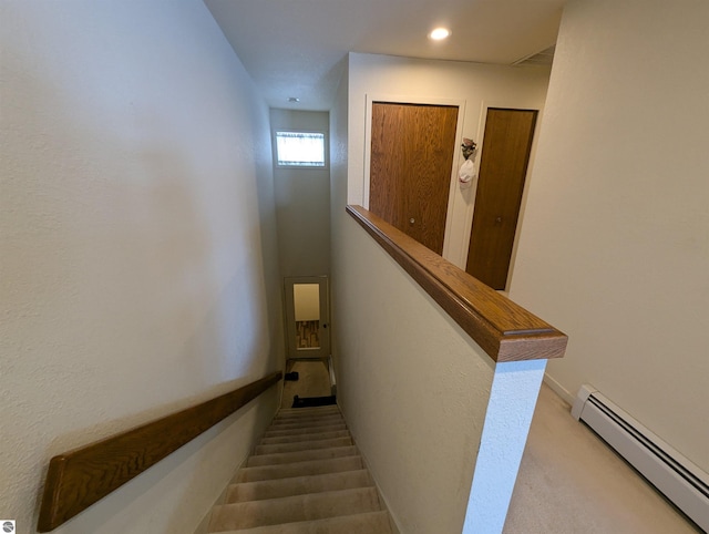 staircase featuring carpet floors and a baseboard radiator