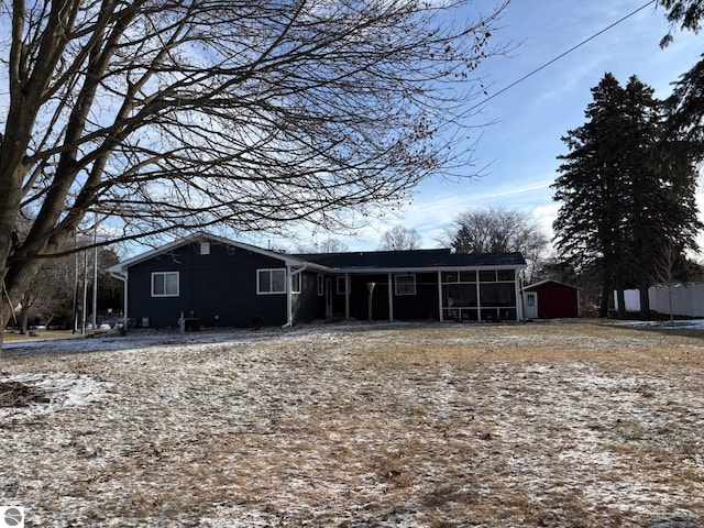 back of house with a sunroom