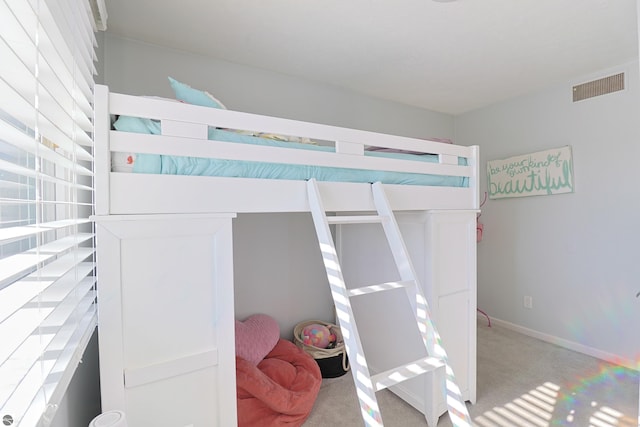 bedroom with light colored carpet