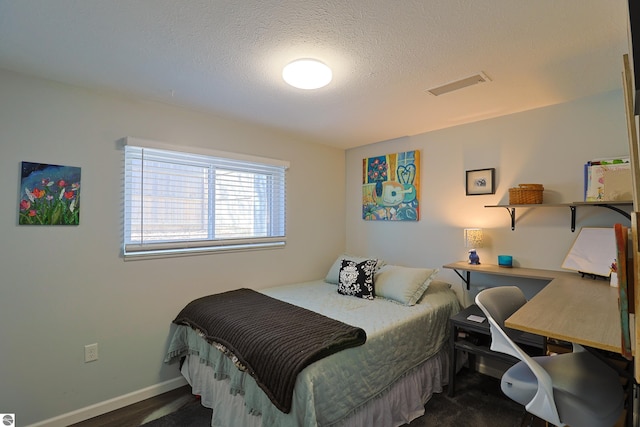 bedroom featuring a textured ceiling