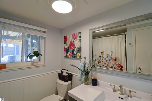 bathroom featuring vanity and toilet