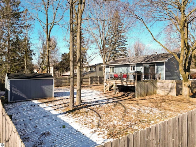 exterior space with a wooden deck and a storage unit