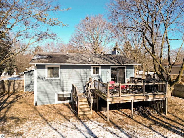 back of house featuring a wooden deck