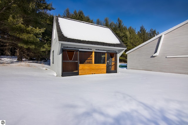 view of snow covered garage