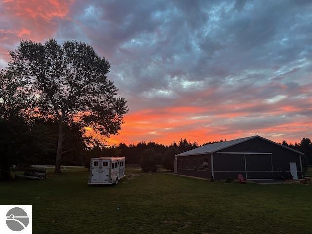 yard at dusk with a shed