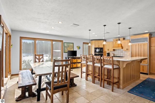 dining room with a textured ceiling