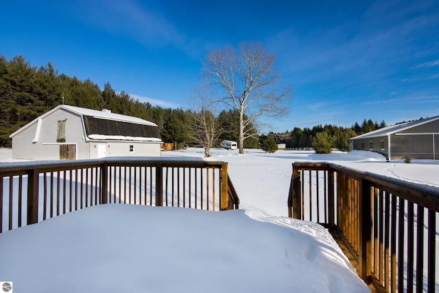 view of snow covered deck