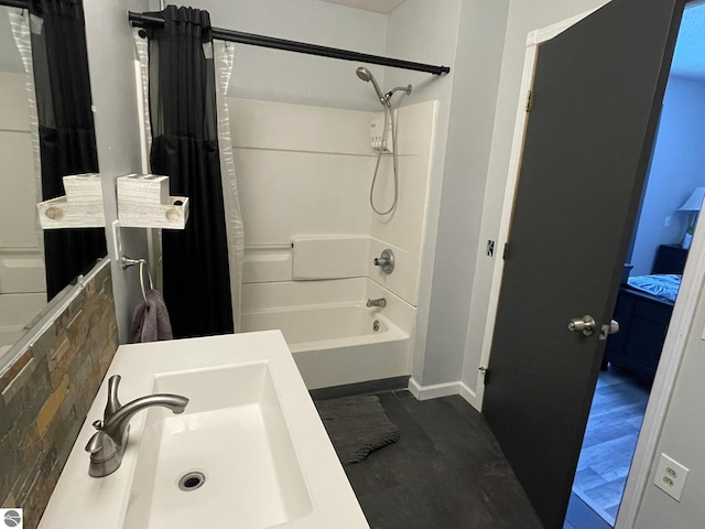 bathroom with sink and shower / bath combination with curtain