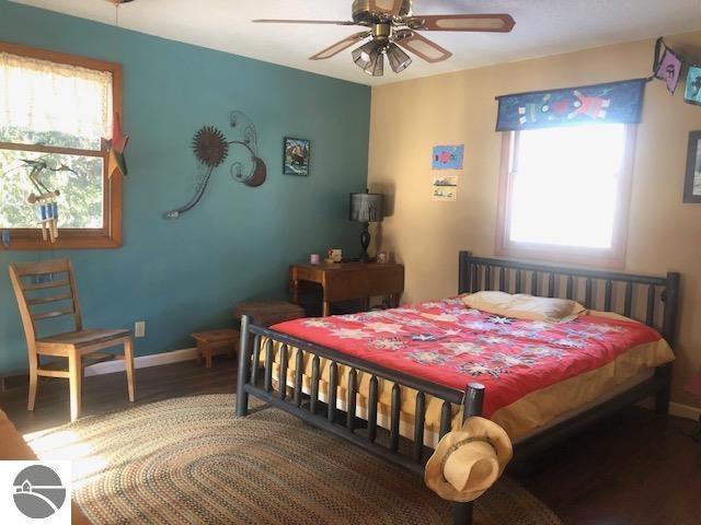 bedroom featuring wood-type flooring and ceiling fan