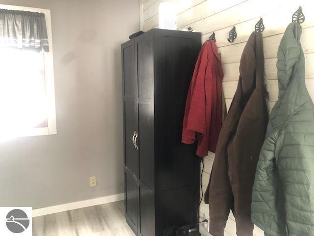 mudroom with wood-type flooring