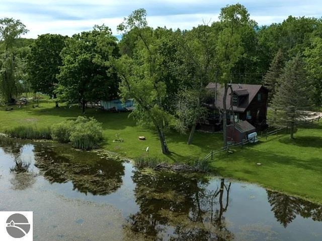 birds eye view of property featuring a water view