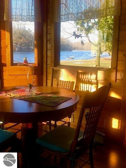 dining space with hardwood / wood-style flooring and a wealth of natural light