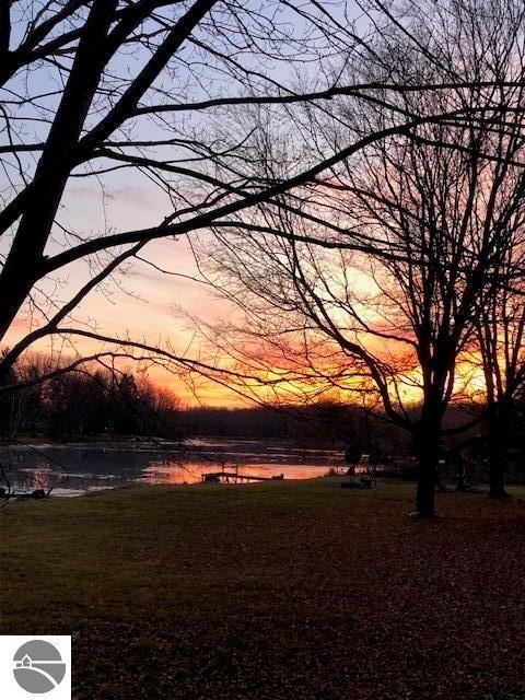 yard at dusk with a water view