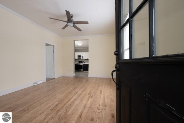 living room featuring ornamental molding, ceiling fan, and light wood-type flooring