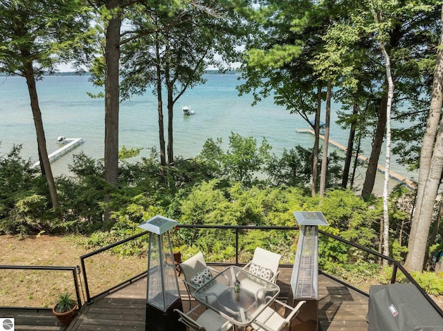 wooden deck featuring a water view