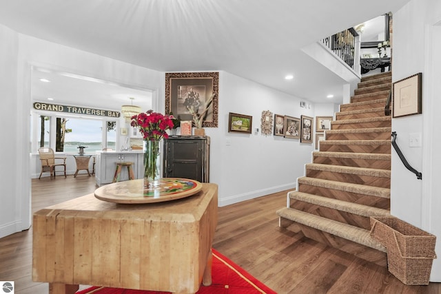 stairway with wood-type flooring