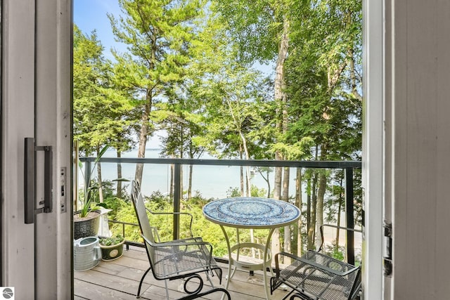 balcony featuring a water view