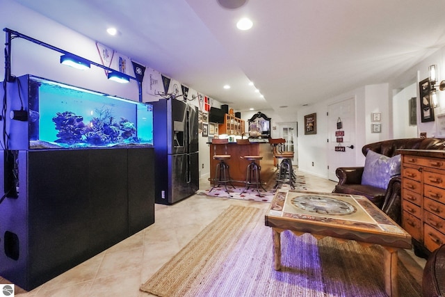 tiled living room featuring bar