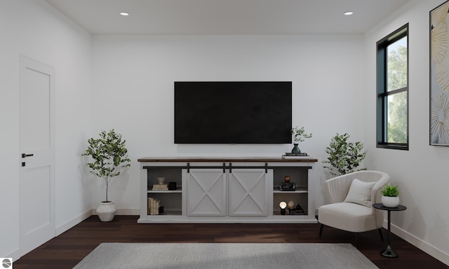 living room with a healthy amount of sunlight and dark wood-type flooring