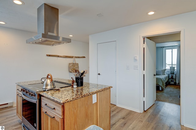 kitchen featuring stainless steel electric range, light hardwood / wood-style flooring, island exhaust hood, light stone countertops, and a baseboard heating unit