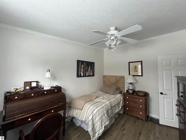 bedroom with dark wood-type flooring, ornamental molding, and a textured ceiling