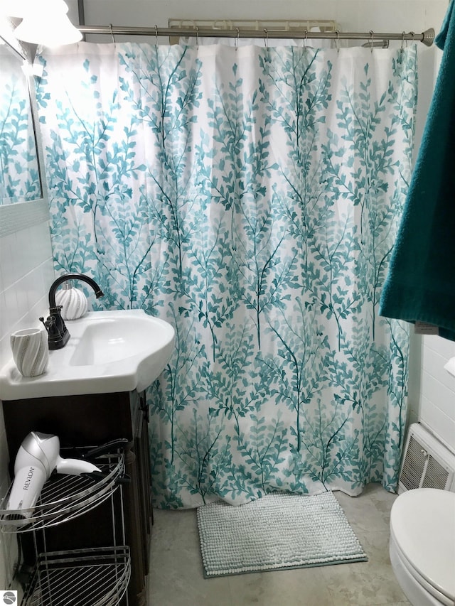 bathroom with vanity and toilet