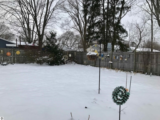 view of yard layered in snow