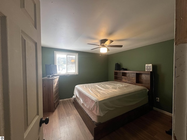 bedroom featuring hardwood / wood-style flooring and ceiling fan