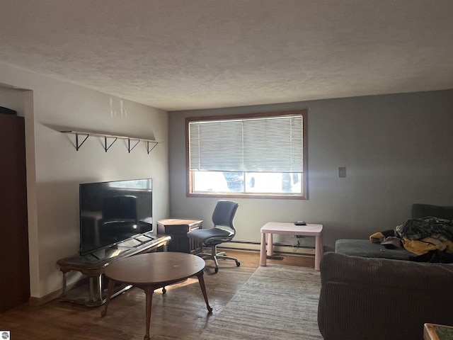 office featuring hardwood / wood-style flooring and a textured ceiling