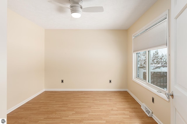 unfurnished room with light hardwood / wood-style flooring and ceiling fan