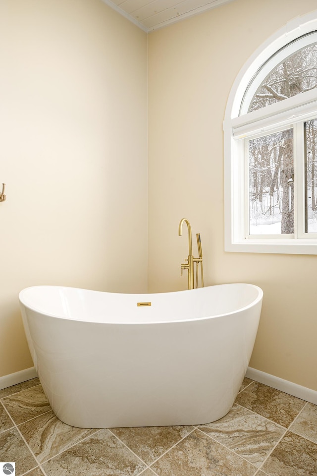 bathroom with a tub to relax in