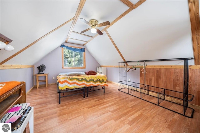 bedroom featuring lofted ceiling, ceiling fan, and light wood-type flooring