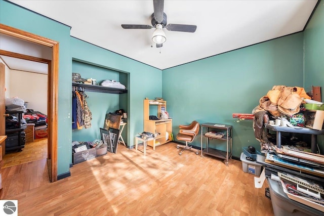 interior space with hardwood / wood-style floors and ceiling fan