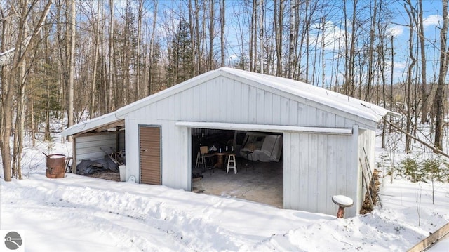 view of snow covered garage