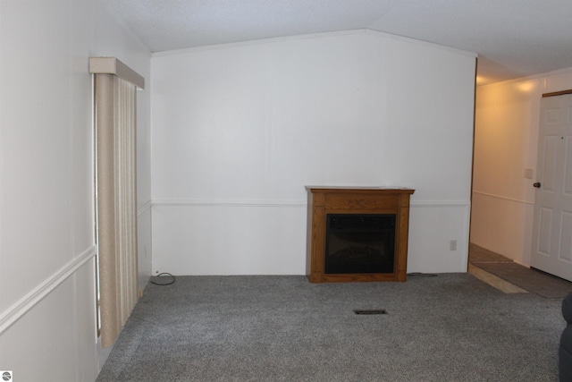 unfurnished living room with lofted ceiling and carpet