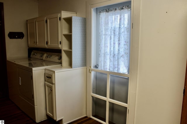 washroom with washer and clothes dryer and cabinets