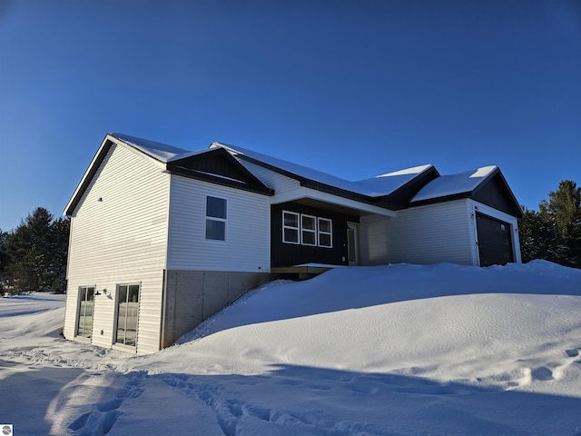 9872 Cushman Ct, Williamsburg, MI 49690 - view of front of property with an attached garage