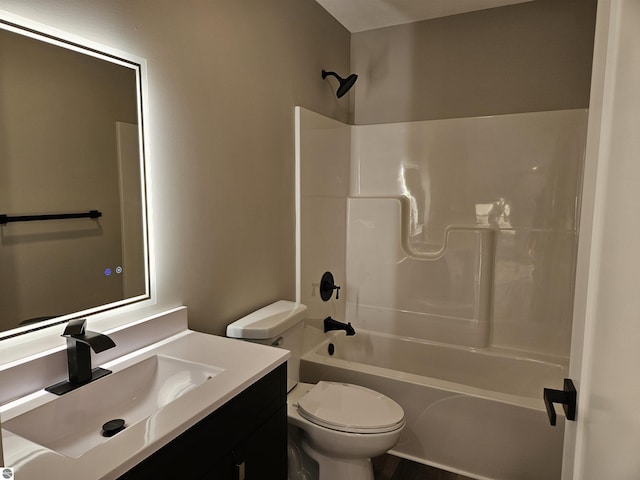 full bathroom with shower / bath combination, vanity, and toilet