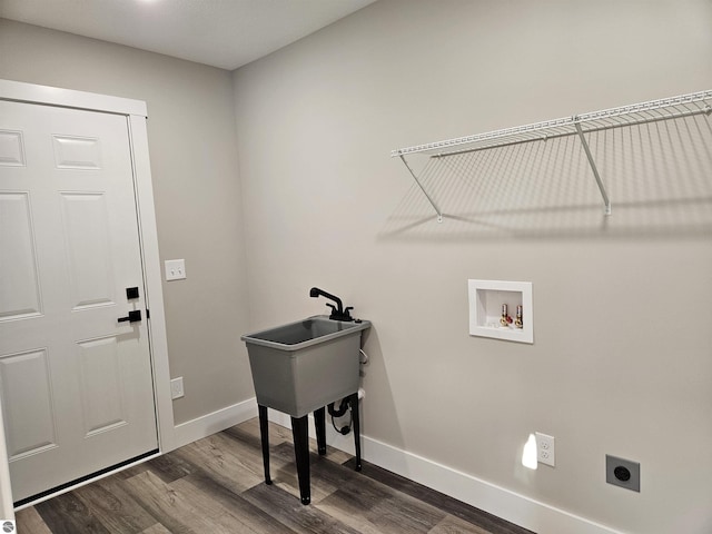 laundry room featuring sink, wood-type flooring, hookup for an electric dryer, and hookup for a washing machine