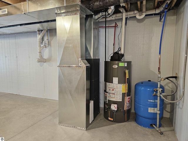 utility room featuring heating unit and gas water heater