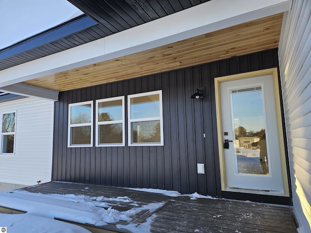 9872 Cushman Ct, Williamsburg, MI 49690 - doorway to property with board and batten siding