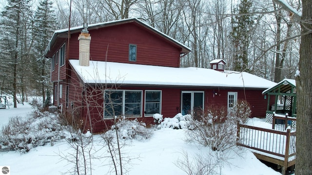 view of snow covered house